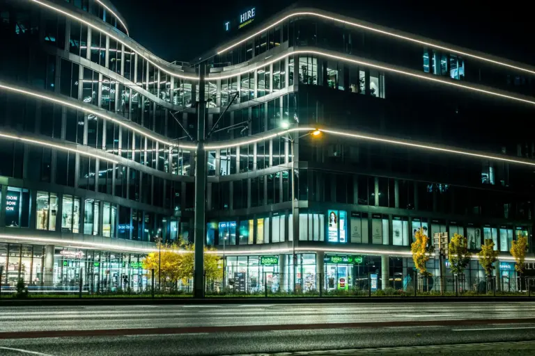 Commercial office building with lights on at night