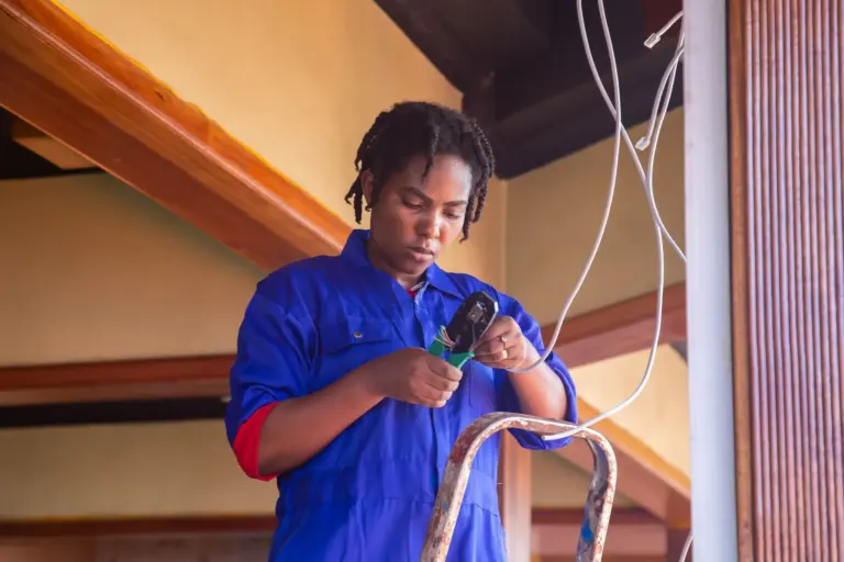 Electrician working on wiring inside a home