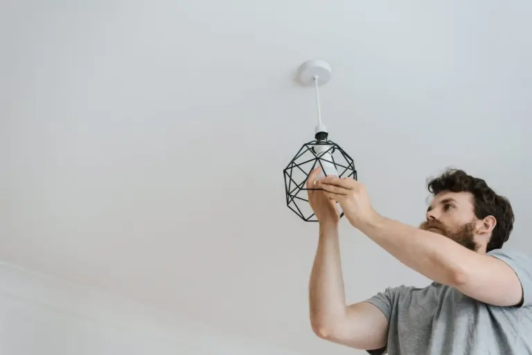 Installing a new light fixture during a home renovation