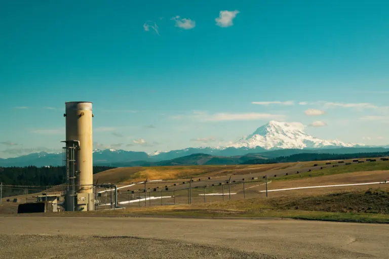 Mount Rainier rising above an industrial valley foreground